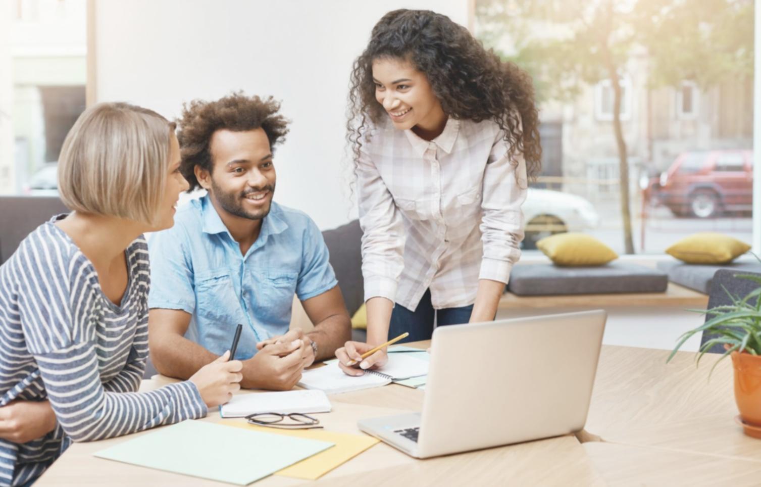 International students learning financial planning in modern classroom setting